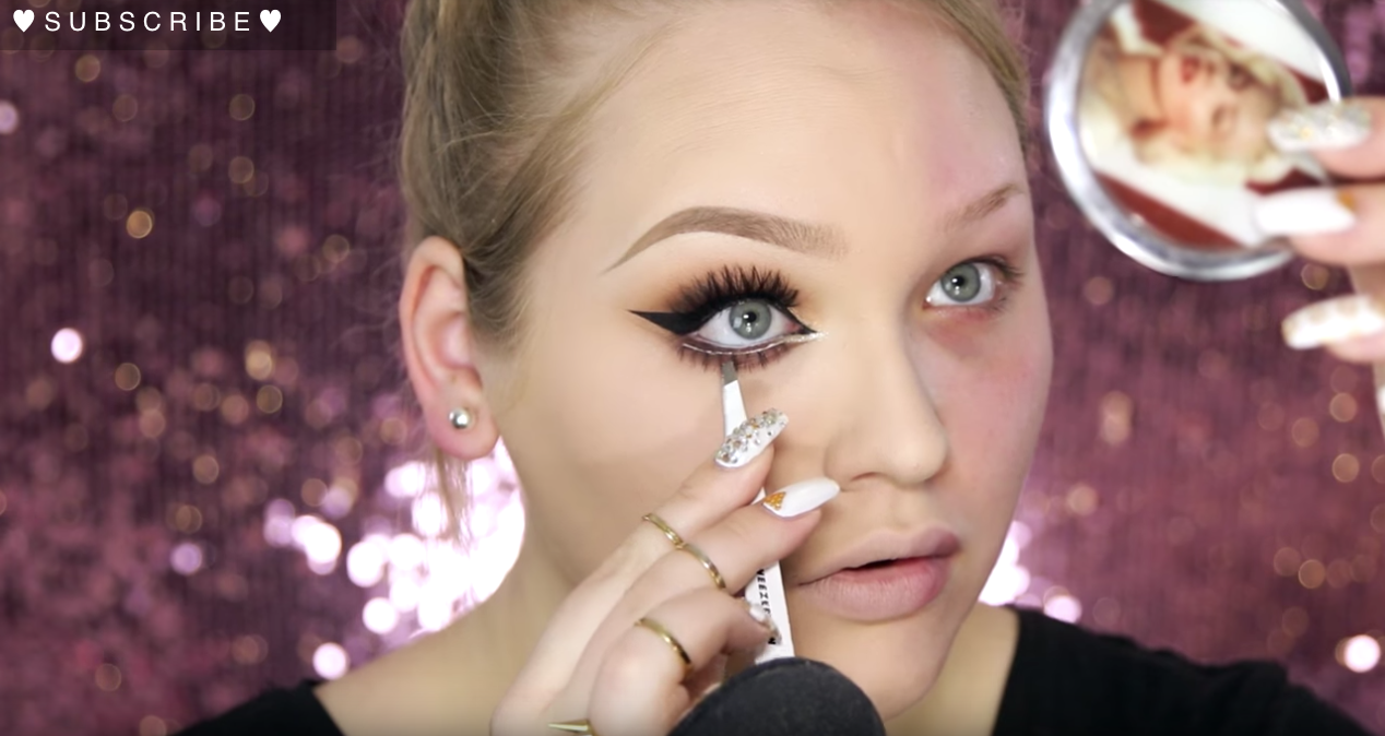 girl putting on makeup