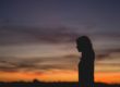 silhouette of a woman with sunrise
