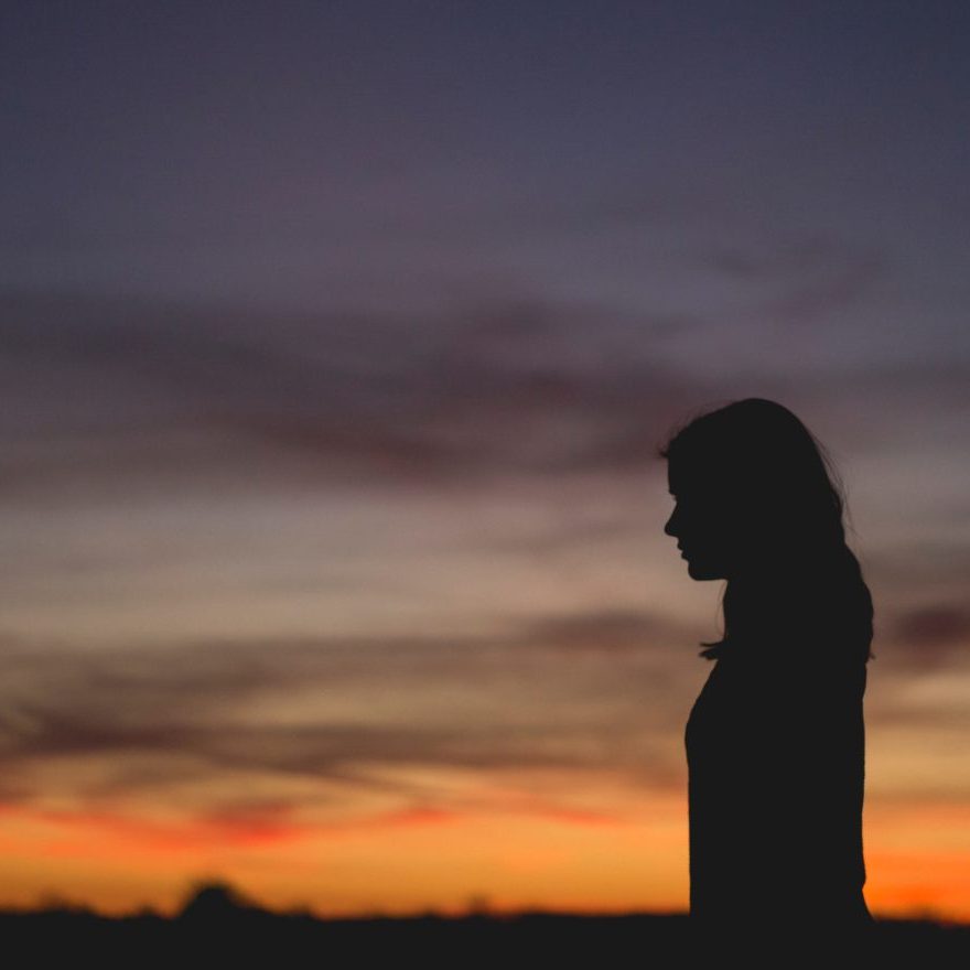 silhouette of a woman with sunrise